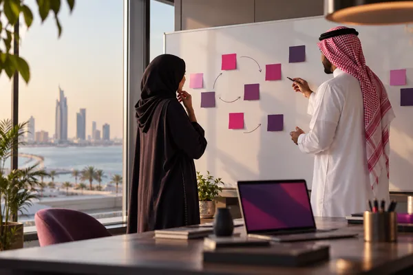 Digital Marketing Agency - Graphic design services, Web design , Branding and identity design , SEO optimization 55 Two colleagues planning strategy with sticky notes on a whiteboard
